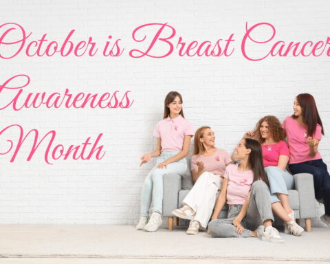 An image of young women sitting on a couch and discussing breast cancer. Text overlay says "October is Breast Cancer Awareness Month."