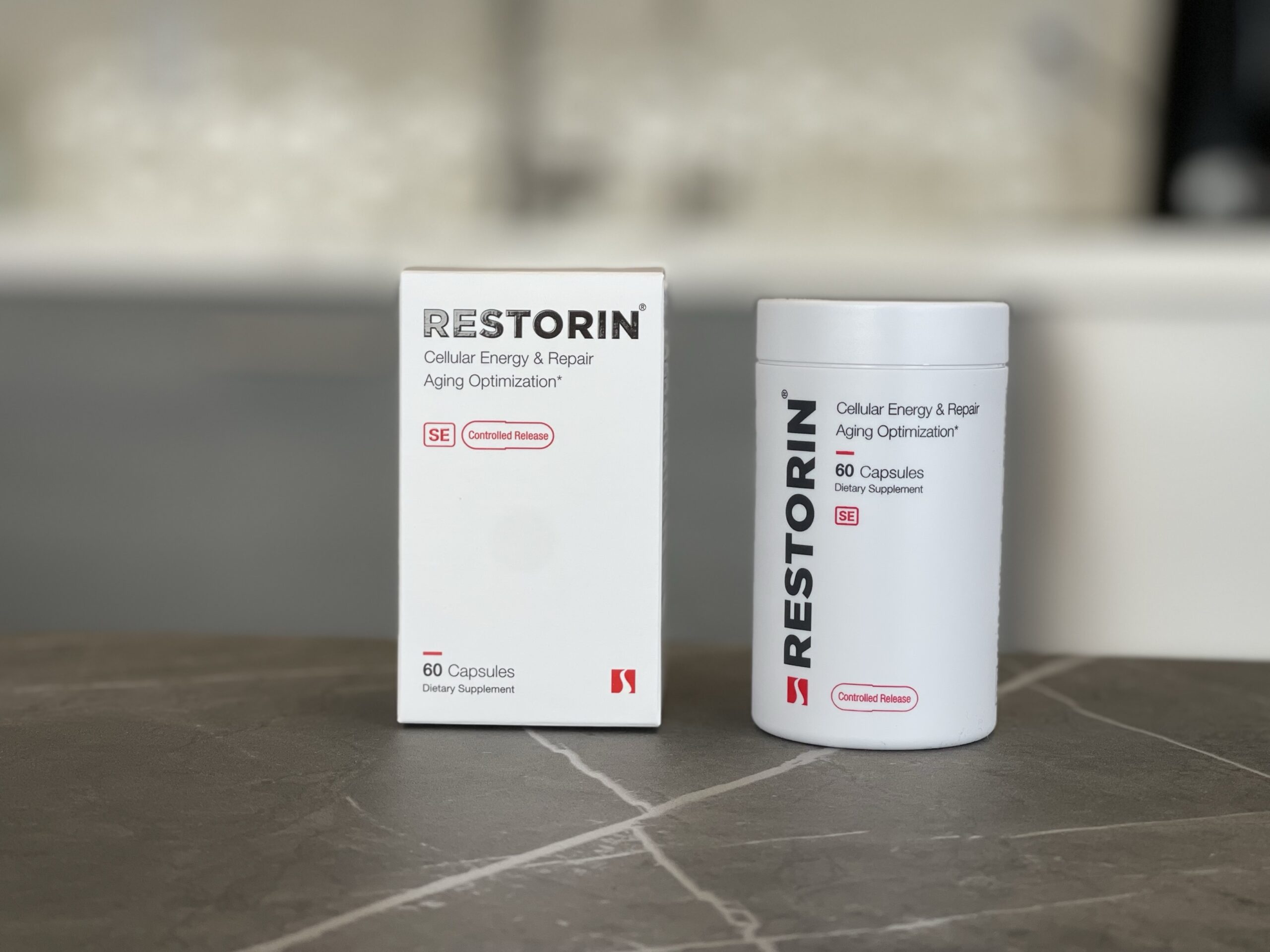 An image of a RESTORIN bottle and the box it came in on a counter top.