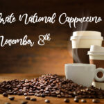 Celebrate National Cappuccino Day on November 8th. A cozy arrangement of a steaming white coffee cup and two to-go coffee cups surrounded by coffee beans, set against a warm, rustic wooden background.