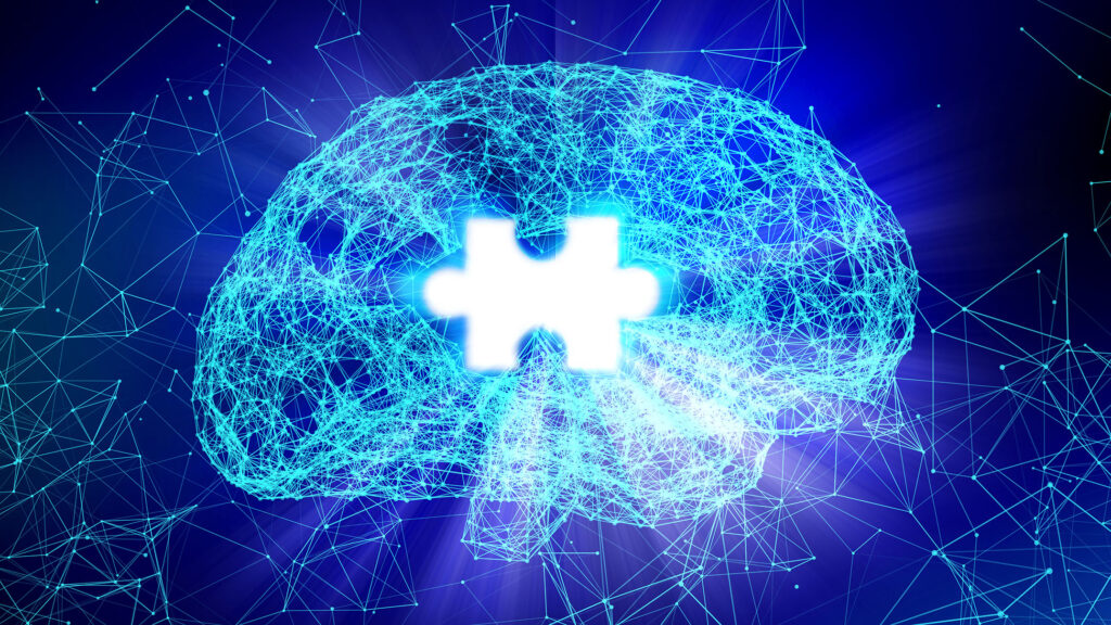 A digital representation of a human brain formed by interconnected glowing blue lines and nodes, symbolizing neural networks and scientific innovation. The brain has a bright, white puzzle piece-shaped gap in the center, signifying memory loss or cognitive challenges. The image has a futuristic aesthetic, with a dark blue background and subtle light flares, evoking themes of Alzheimer's research and advanced technology.