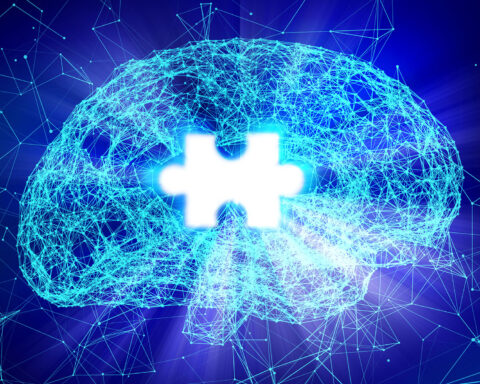 A digital representation of a human brain formed by interconnected glowing blue lines and nodes, symbolizing neural networks and scientific innovation. The brain has a bright, white puzzle piece-shaped gap in the center, signifying memory loss or cognitive challenges. The image has a futuristic aesthetic, with a dark blue background and subtle light flares, evoking themes of Alzheimer's research and advanced technology.