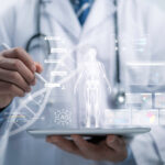 An image of a doctor holding a holograph-generating tablet. The holograph displayed is a human next, with multiple boxes containing characteristics of aging surrounding it, representing the biomarkers of aging.