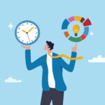 A cartoon image of a man in a blue suit jacket, yellow tie, and navy pants with his tie flapping in the wind to his right, set on the backdrop of a blue sky with fluffy white clouds. His right arm is bent at the elbow upwards as if to raise something above his head. Hovering above his open hand is a sparkling clock, symbolizing time management. His left are is also bent upward at the elbow and his hand is making the motion of spinning a basketball with an outstretched finder. Hovering above his finger is a pie chart with a light bulb inside illustrating the idea of proper structured procrastination can be achieved while improving time management and efficiency.