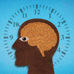 A stylized illustration of a human head in profile, the silhouette dark and textured like cut paper, with an amber brain sketched inside. An eye peers outward, open and alert, while behind the head a clock face radiates, its numbers and tick marks encircling the figure against a bright blue backdrop. The composition evokes the relentless cadence of time interwoven with cognition and the biological rhythms that govern human aging.