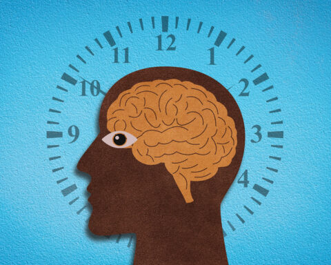 A stylized illustration of a human head in profile, the silhouette dark and textured like cut paper, with an amber brain sketched inside. An eye peers outward, open and alert, while behind the head a clock face radiates, its numbers and tick marks encircling the figure against a bright blue backdrop. The composition evokes the relentless cadence of time interwoven with cognition and the biological rhythms that govern human aging.