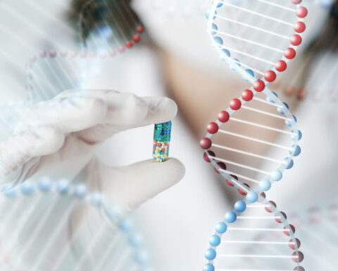 A researcher wearing white medical gloves holds a single capsule filled with multicolored microbeads, suspended against a soft-focus background of intertwining DNA double helices. The image symbolizes the fusion of genetics and medicine—precision therapies tailored to the individual—highlighting the promise of pharmacogenomics in shaping personalized, age-responsive treatments.