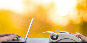 A side-by-side scene showing hands typing on a modern laptop on the left and hands using a vintage typewriter on the right, set against a warm, glowing yellow background, symbolizing the contrast between old and new approaches.